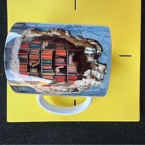 Artistic Blue and White Mug with Bookshelf Design